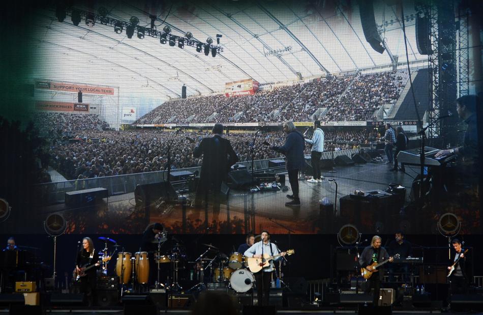 Big screens give fans a close-up of the Eagles performing at Forsyth Barr Stadium on Saturday.
