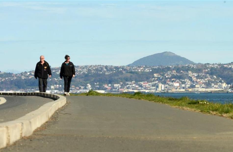 Selwyn and Pam Chalmers, of Macandrew Bay, enjoy a stroll on a completed section of the Otago...