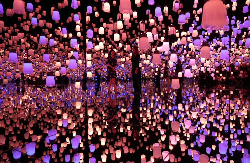 U.S. first lady Melania Trump and Akie Abe, wife of Japanese Prime Minister Shinzo Abe, tour the teamLab Borderless exhibit. Photo: Reuters