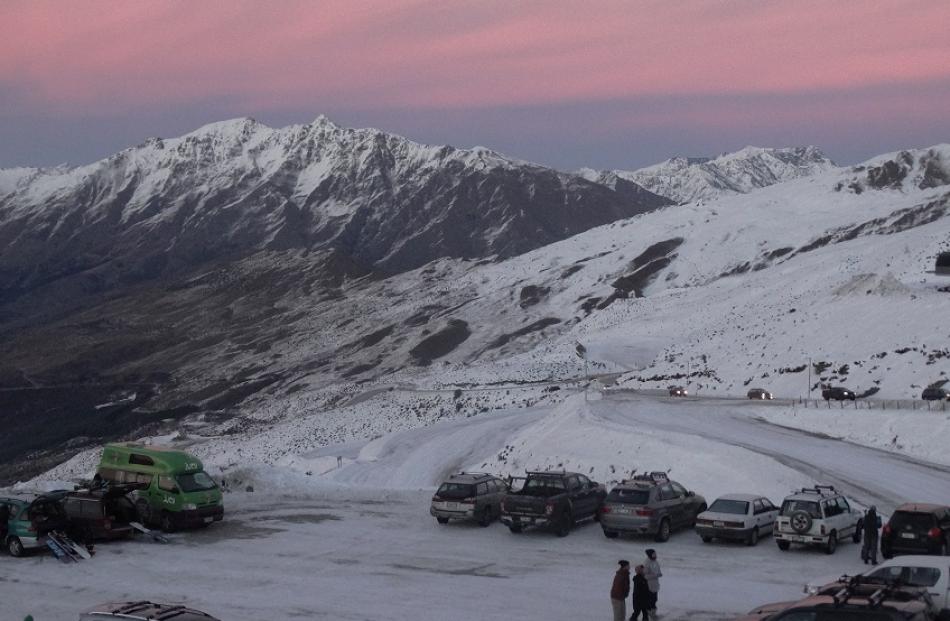 Keen snow bunnies make their way up the mountain early this morning. 