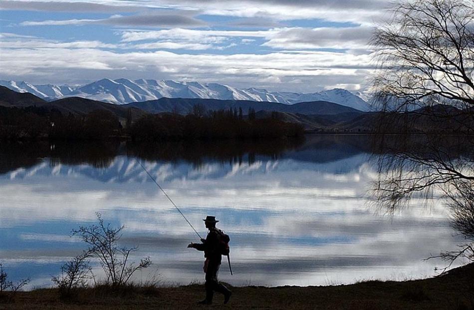 A fisherman tries to find a fishing spot at Sailors Cutting near Otematata. Photo by ODT.