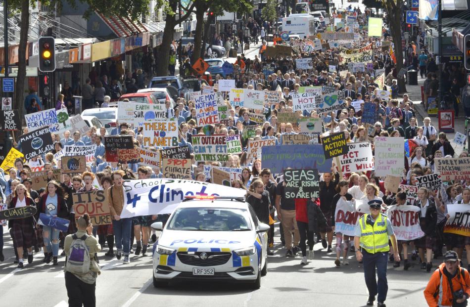 Thousands of protesters calling for action against climate change swarmed down George St in Dunedin today. Photo: Gerard O'Brien
