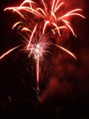 Fireworks over Queenstown Bay at midnight capped off New Year's Eve celebrations. Photo by Guy...