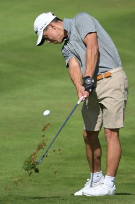 Sungwoo Han pitches to the 11th green at the Otago Golf Club yesterday. PHOTO: GERARD O’BRIEN ...