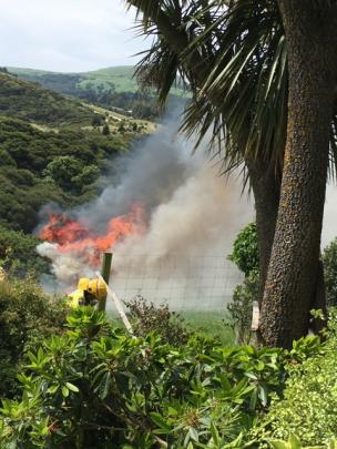 Firefighters tackle the blaze on Scroggs Hill. Photo: Supplied