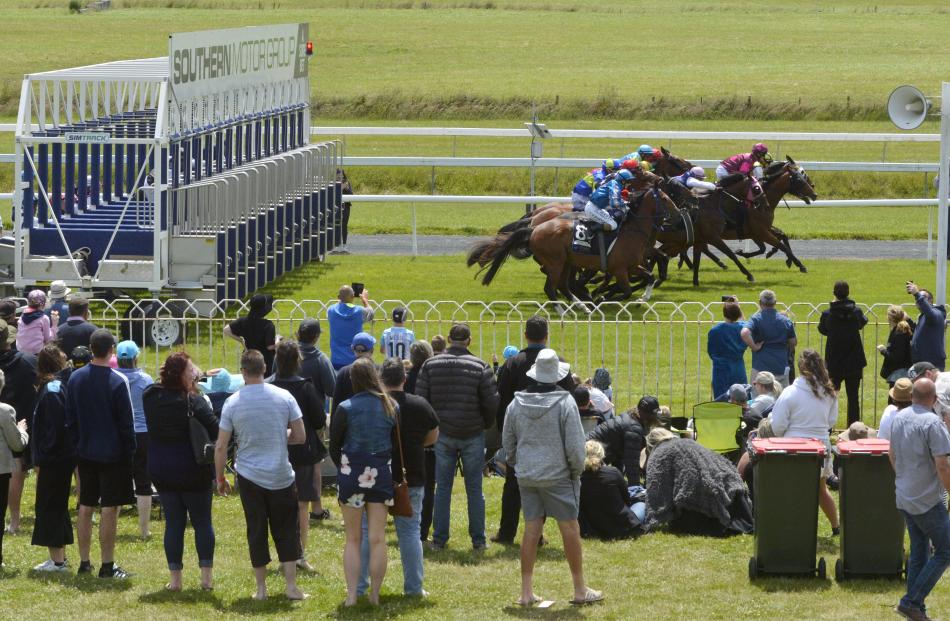 Horses clear the gates in race four at the Boxing Day races at Wingatui yesterday. Photos: Gerard...