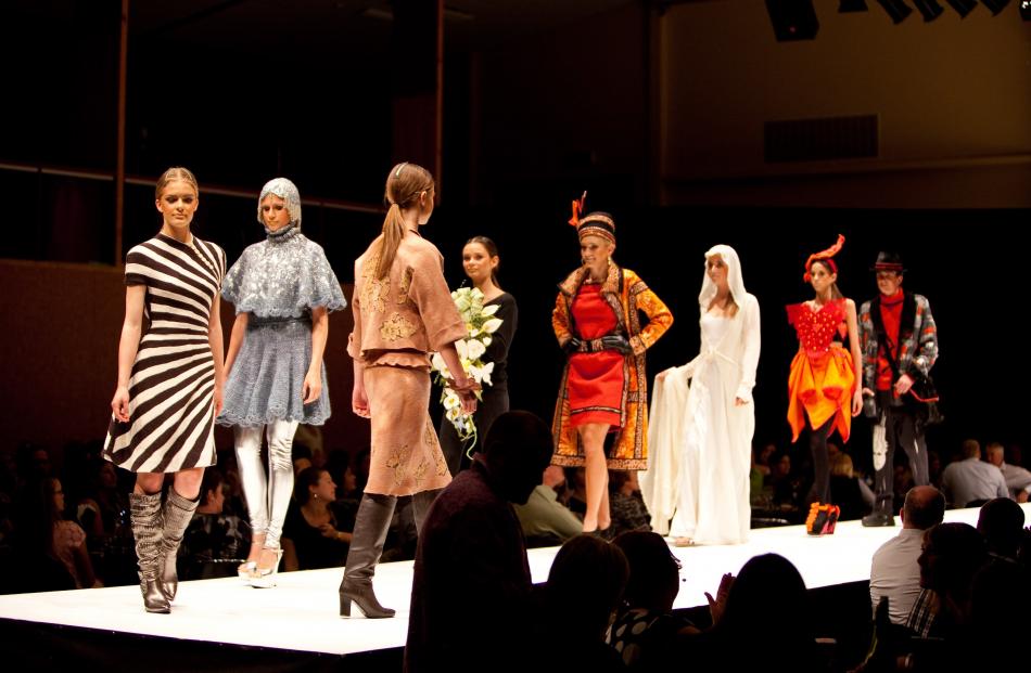 Daphne Randle's "Radiation" (left) parades the catwalk with other category winners at the 2013...
