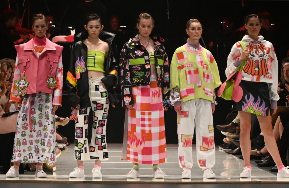 Co-winners were Phoebe Lee, from Otago Polytechnic, and her five models (facing the camera), and...