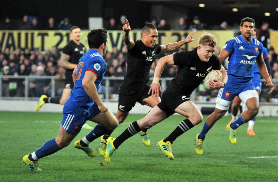 Arron Smith celebrates as Damian McKenzie scores a try against France in Dunedin in 2018. Photo:...
