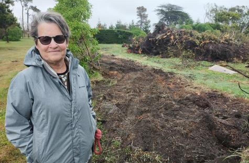 Jennifer Miller stands where the hedge was removed at Blighs Garden. Photo: Star Media