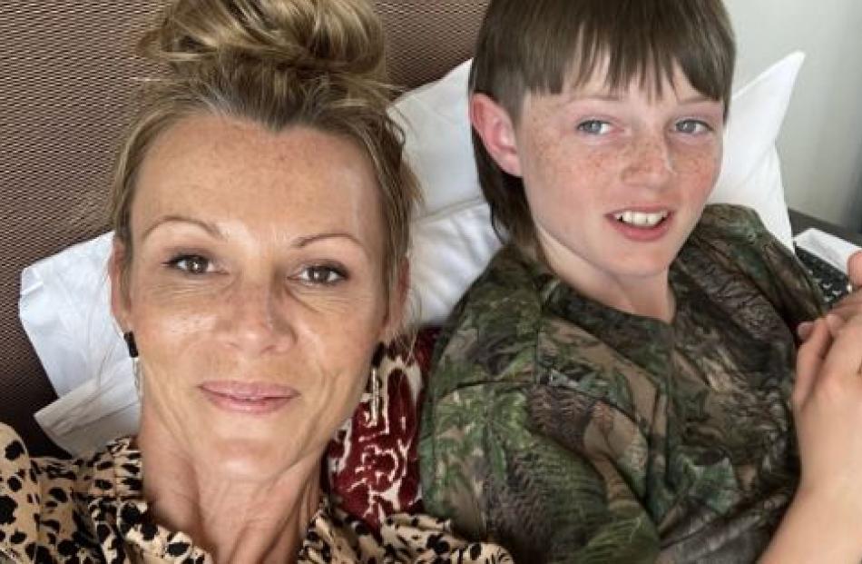 Clare Mooney, with son Charlie Read, said it took media involvement to get the cost of flights...