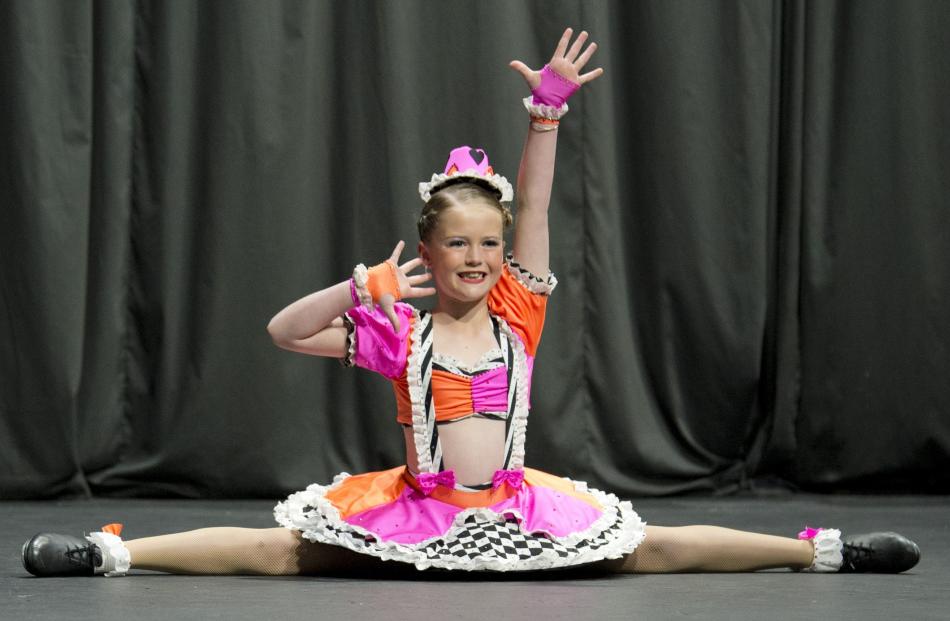 Victoria Dale, 9, does the splits in the open tap under-10 solo section.