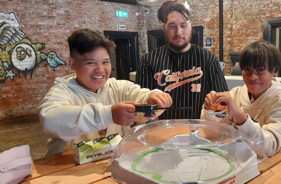 Clash X organiser Alehana Taupe (centre) with Beyblade X competitors Leikyn Taupe (left) and...
