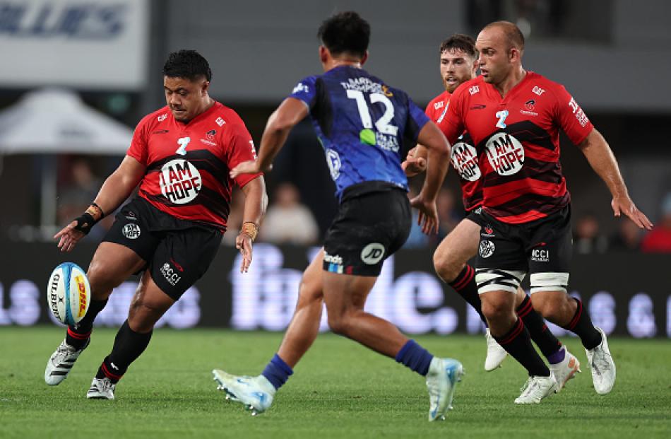 Ioane Moananu chips ahead during the round six Super Rugby Pacific match between the Blues and...