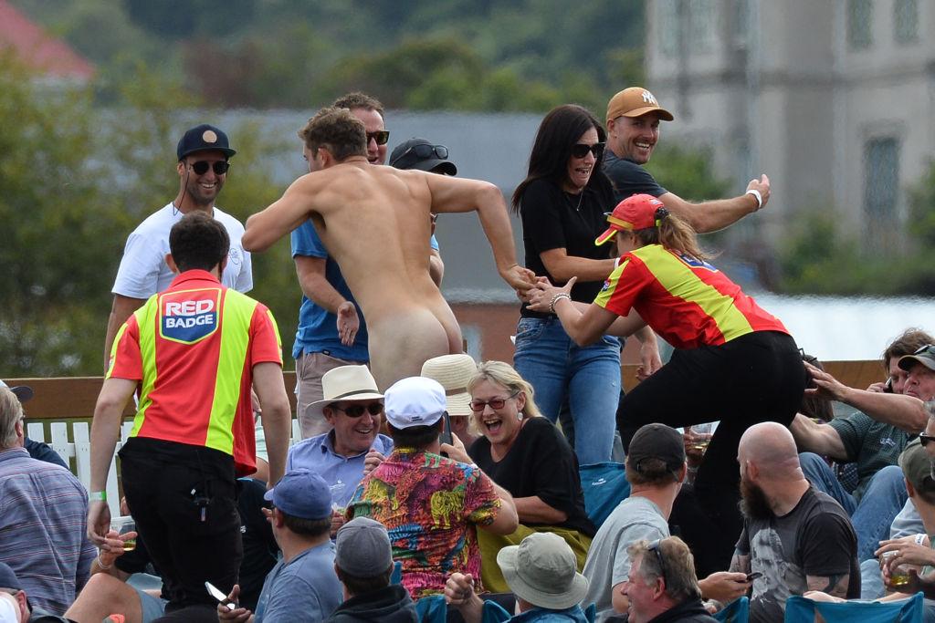 Members of the ground security try to catch a streaker during the second Twenty20 international...