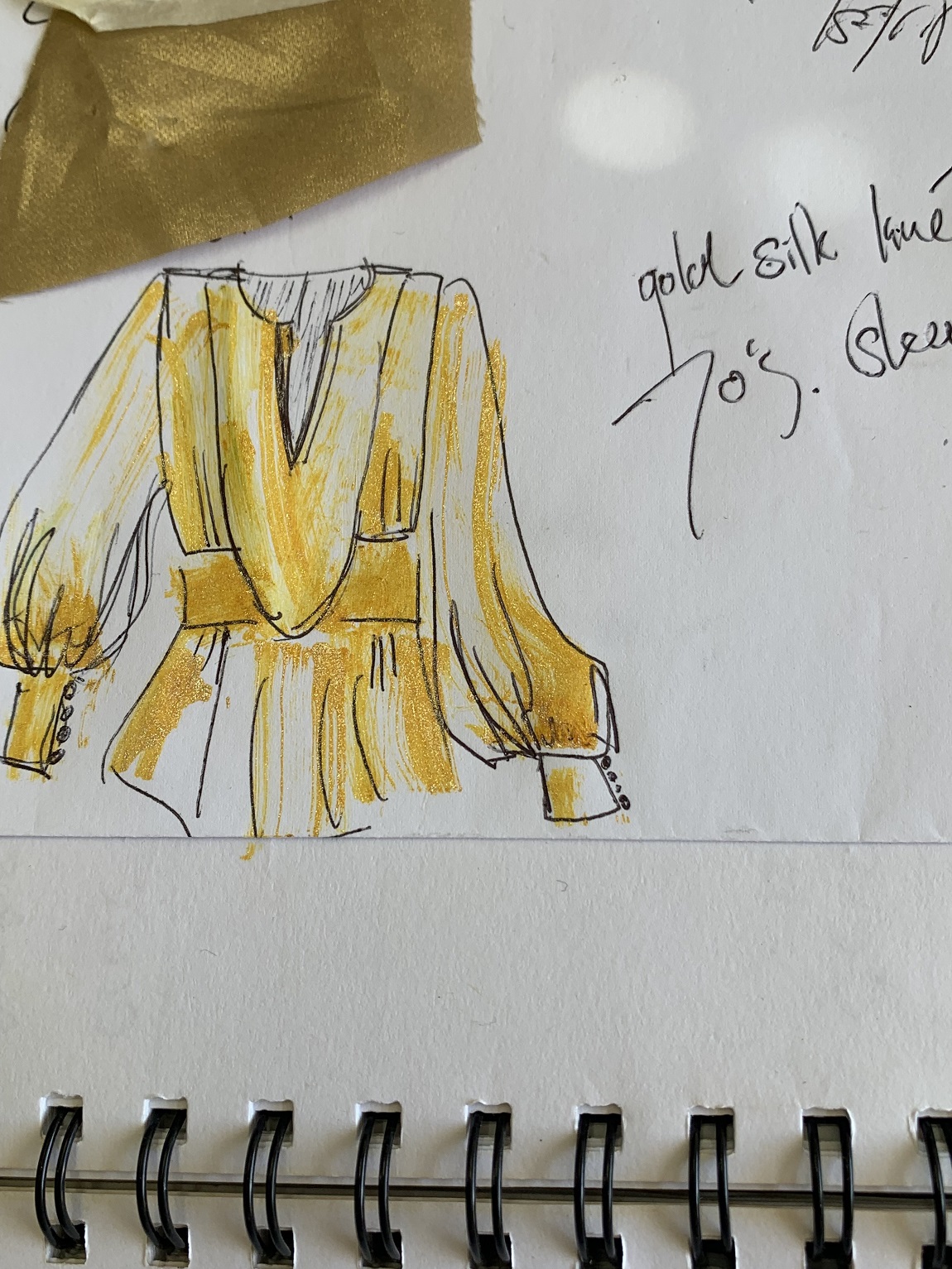 A sketch and fabric sample of the gold silk lame shirt that Carlson created for the tour of Deans...