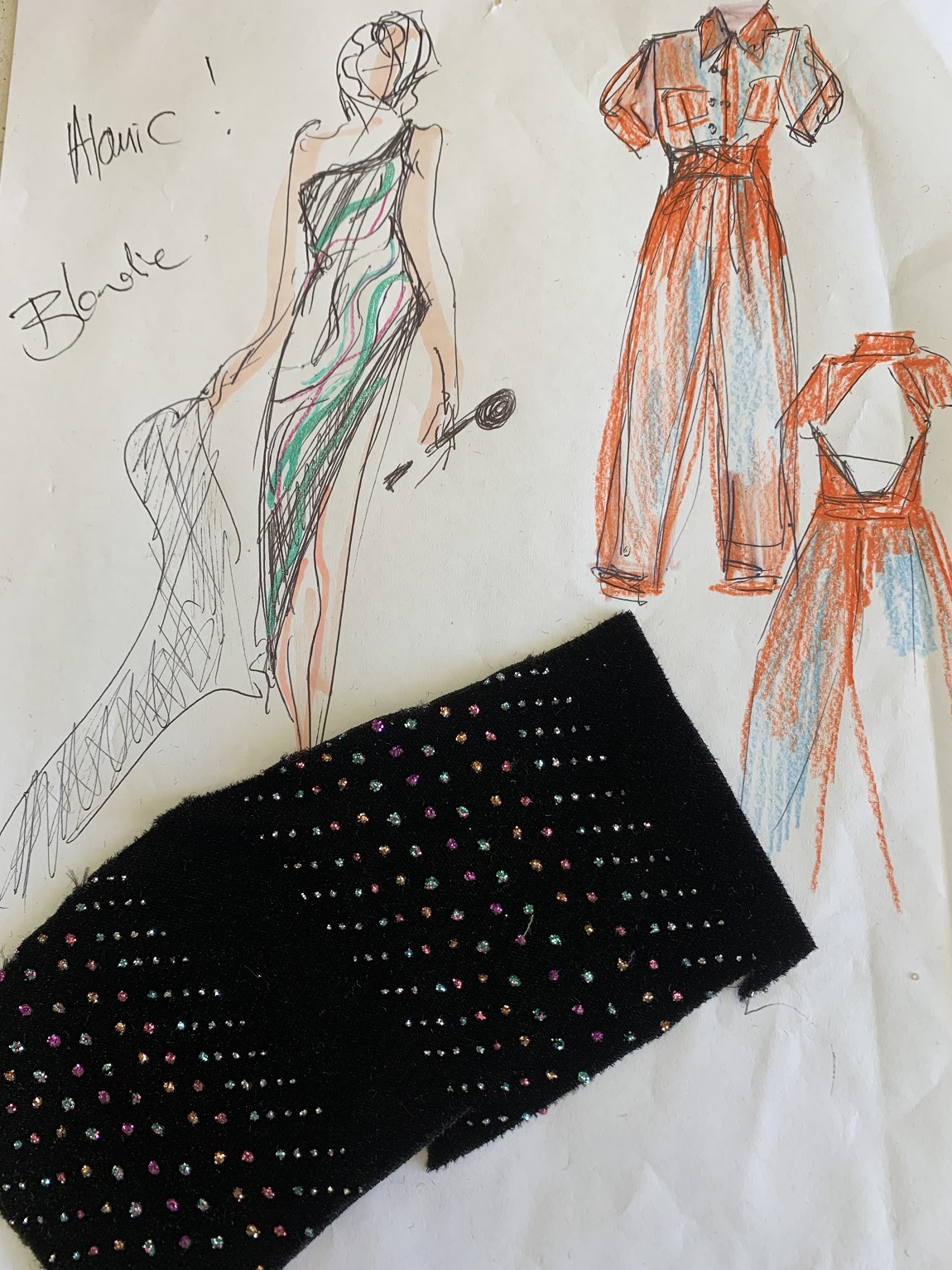 Outfit sketches and fabric samples for costumes to be worn by Deans during her Atomic tour.
 