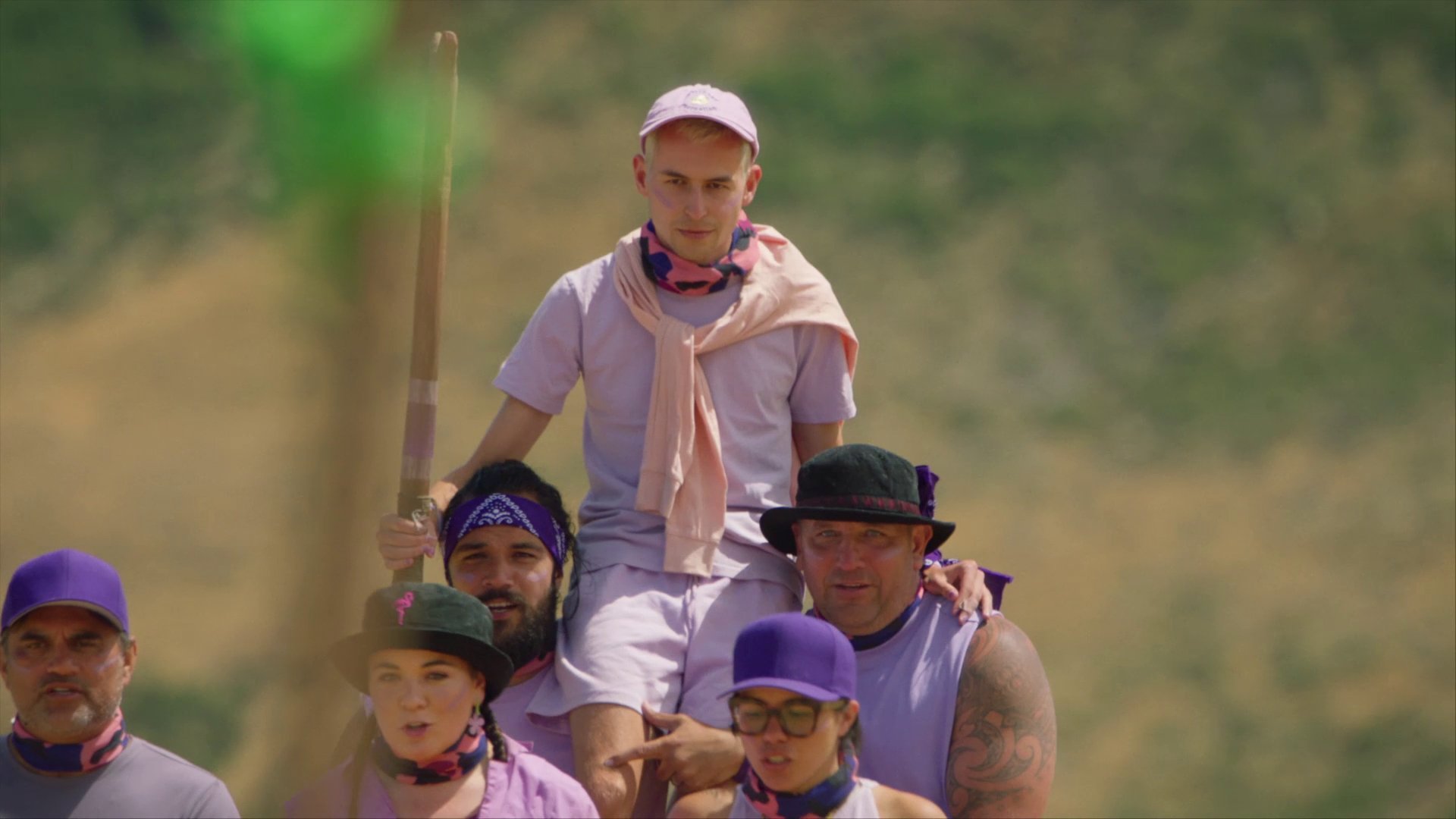 James Mustapic, with the captain’s pou ariki, is carried aloft by his Celebrity Treasure Island...