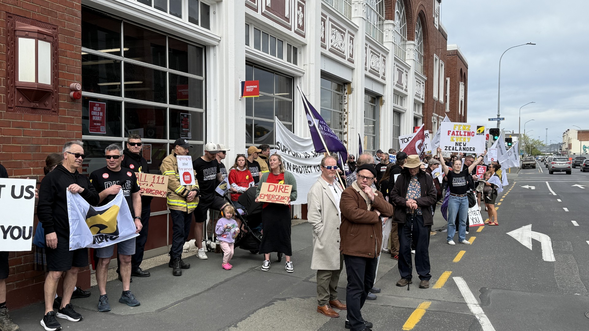 Firefighters and supporters outside the Dunedin Central Fire Station in Castle St. PHOTO: CRAIG...