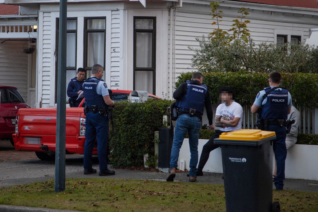 Police outside the Clissold St house in Merivale. Photo: Geoff Sloan