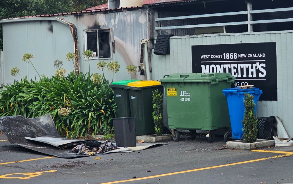 Fire investigator Mitchell Jeffery believes the towels, seen here in front of the rubbish bins,...