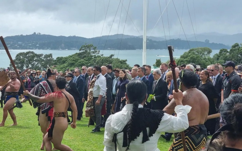 The coalition leaders advancing across the Waitangi Treaty Grounds during the welcome pōwhiri....
