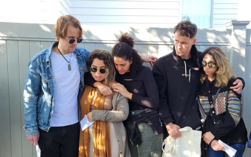 Kyle Whorrall's flatmates honour their friend at the vigil in Auckland on Thursday. Photo: RNZ