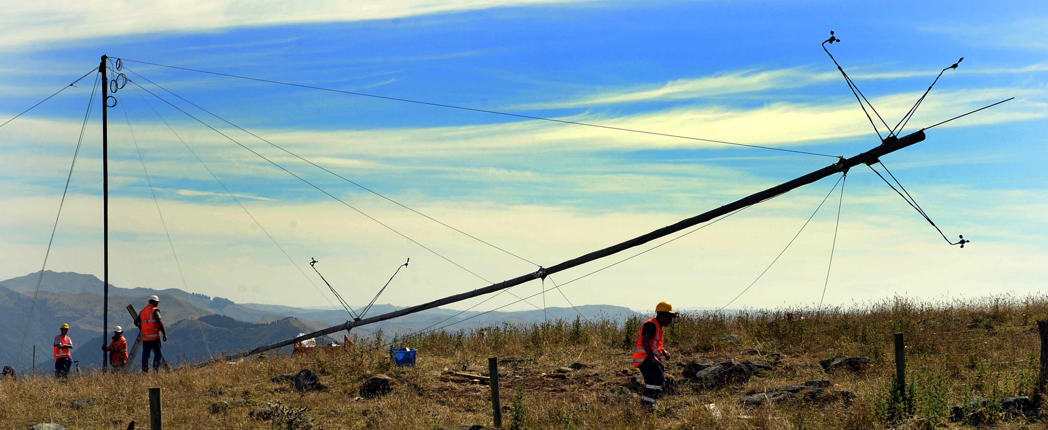 A 30m wind testing tower goes up on Porteous Hill in 2013, as part of the research effort behind the proposed wind turbine for Blueskin Bay. PHOTO: PETER MCINTOSH 