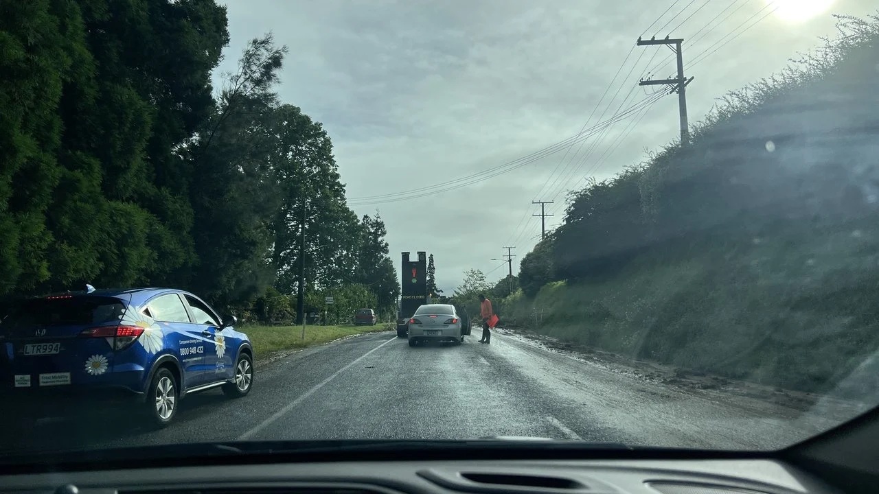 Welcome Bay Road in Tauranga, near where a slip left two people unaccounted for. Photo: RNZ