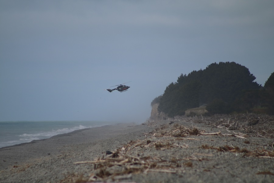 Helicopters assisted with the search at the river mouth this morning. Photos: Kayla Hodge 