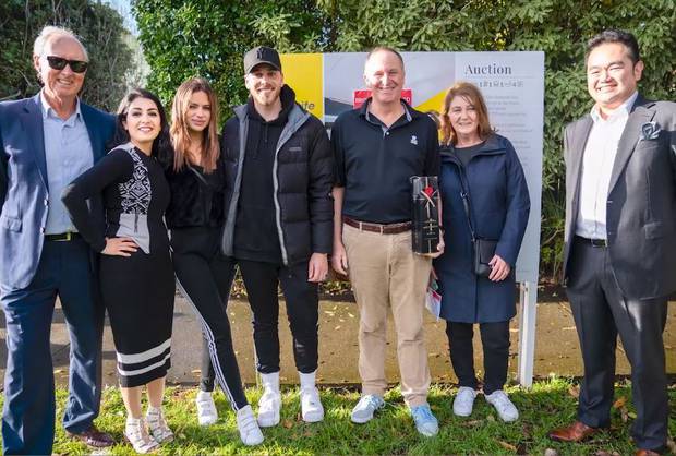 Max, John and Bronagh Key pose with the agents after buying the property. Image: Blank Canvas...