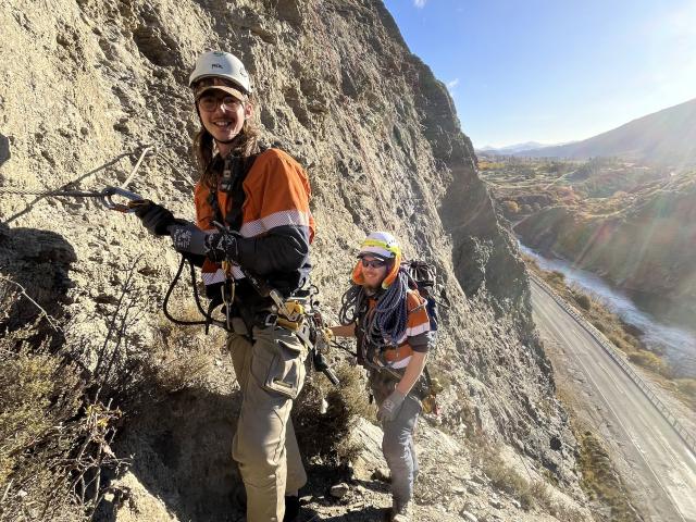 Working on Nevis Bluff, above State Highway 6, earlier this week are Roman Alty (left) and Liam...