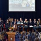 Otago Girls’ High School pupils listen to an announcement about a new prize from New Zealand...